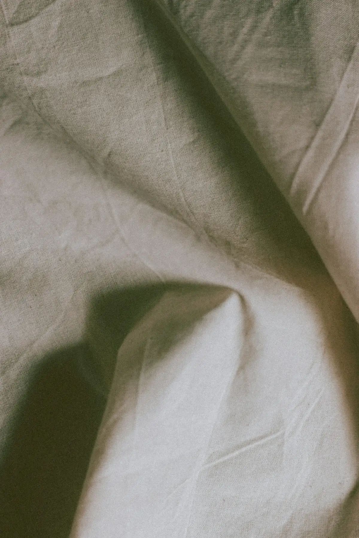 Draped, undyed linen in warm directional window light — the house look